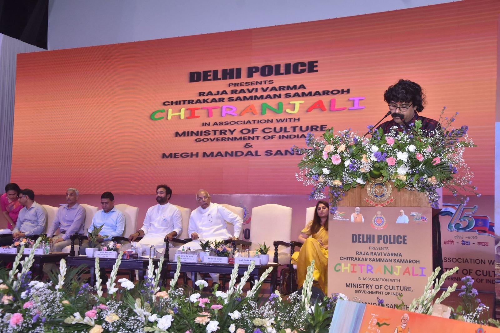 An artist addressing the gathering from the podium at Chitranjali