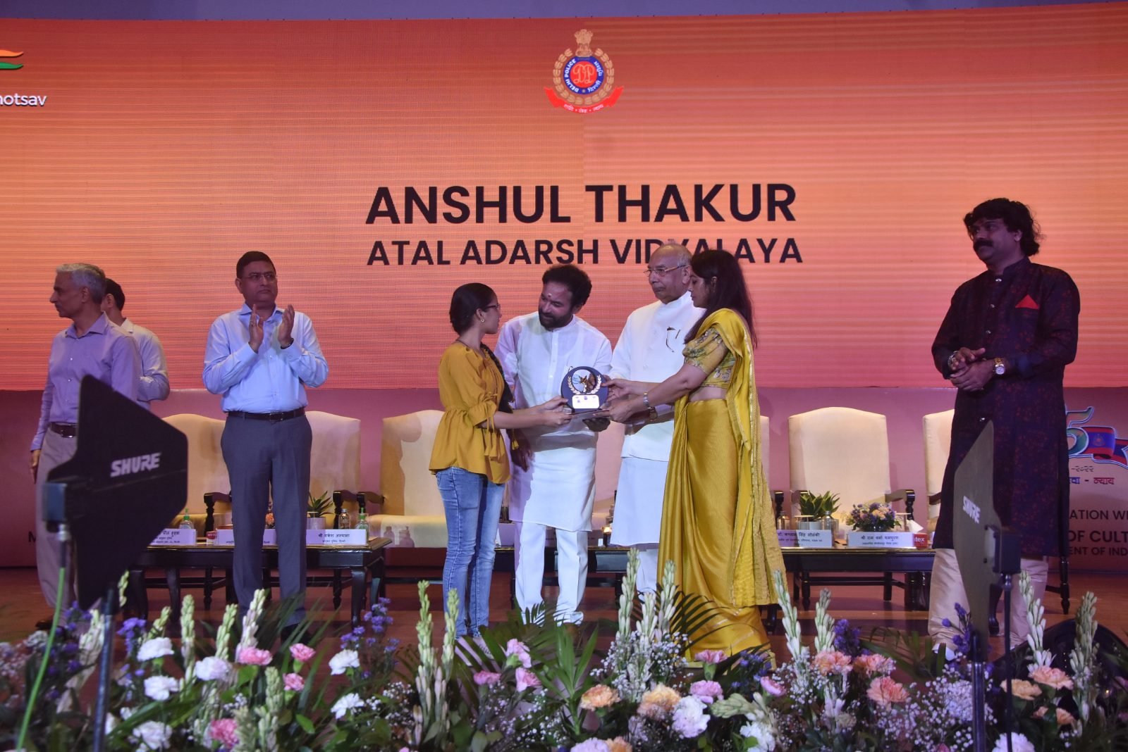 A student of Atal Adarsh Vidyalaya receiving a prize at Chitranjali