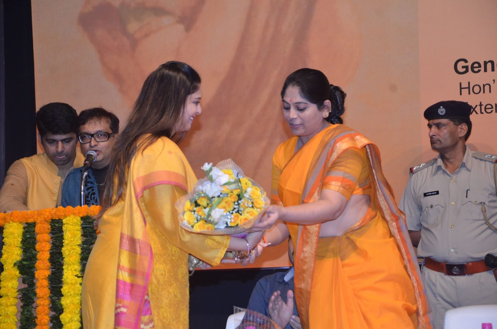 A bouquet being presented to a guest of honour at Chitranjali 2016