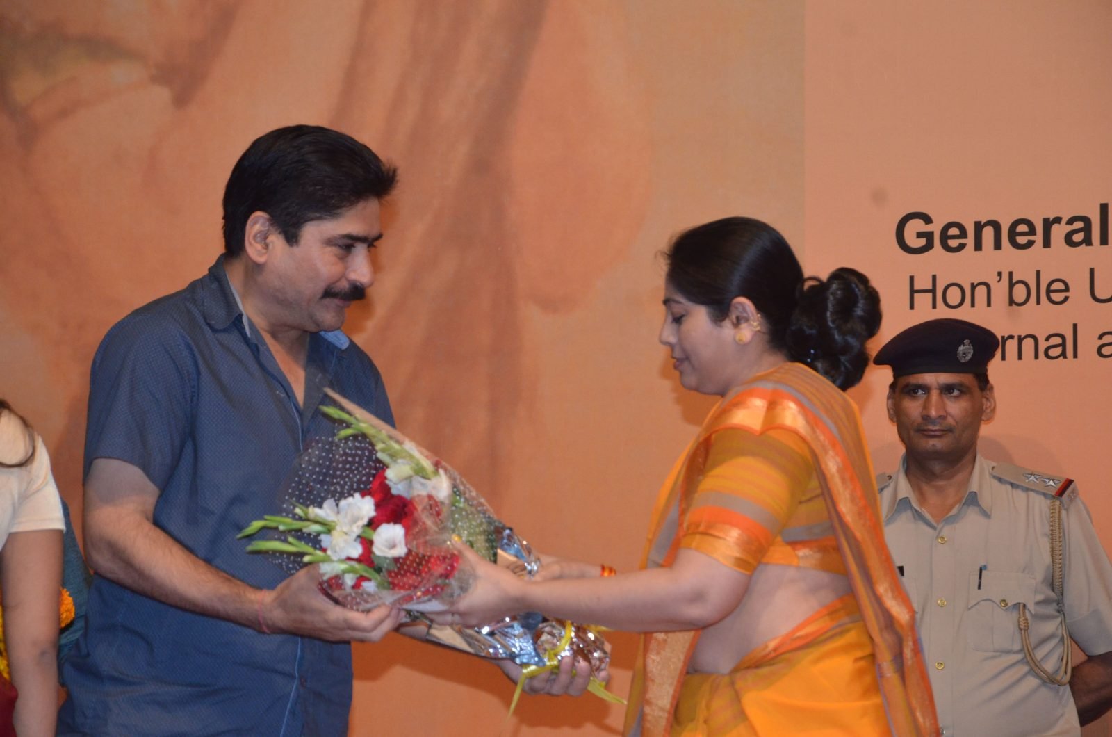 A bouquet being offered to a guest at the Chitranjali 2016 podium