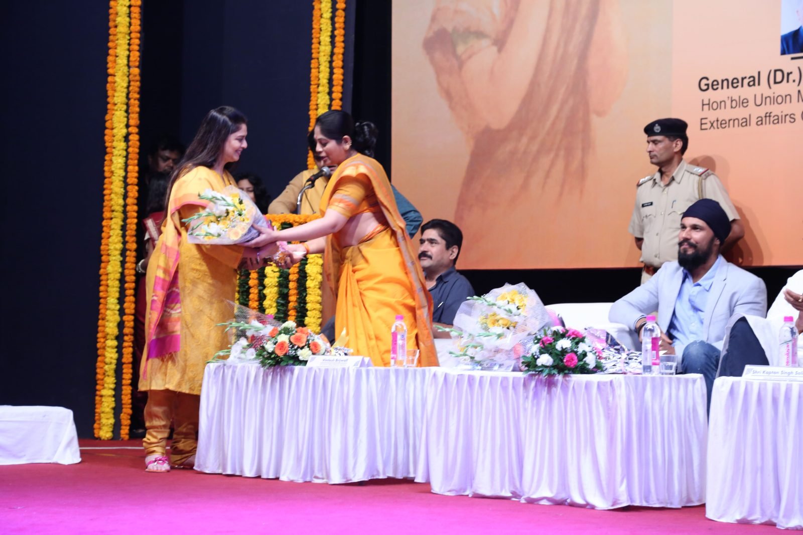 A guest of honour speaking from the podium at Chitranjali 2016