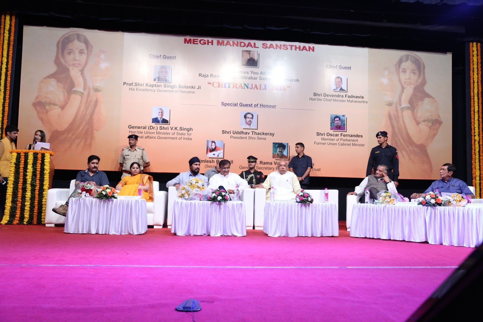 A young artist sketching on the floor beside the dais at Chitranjali 2016