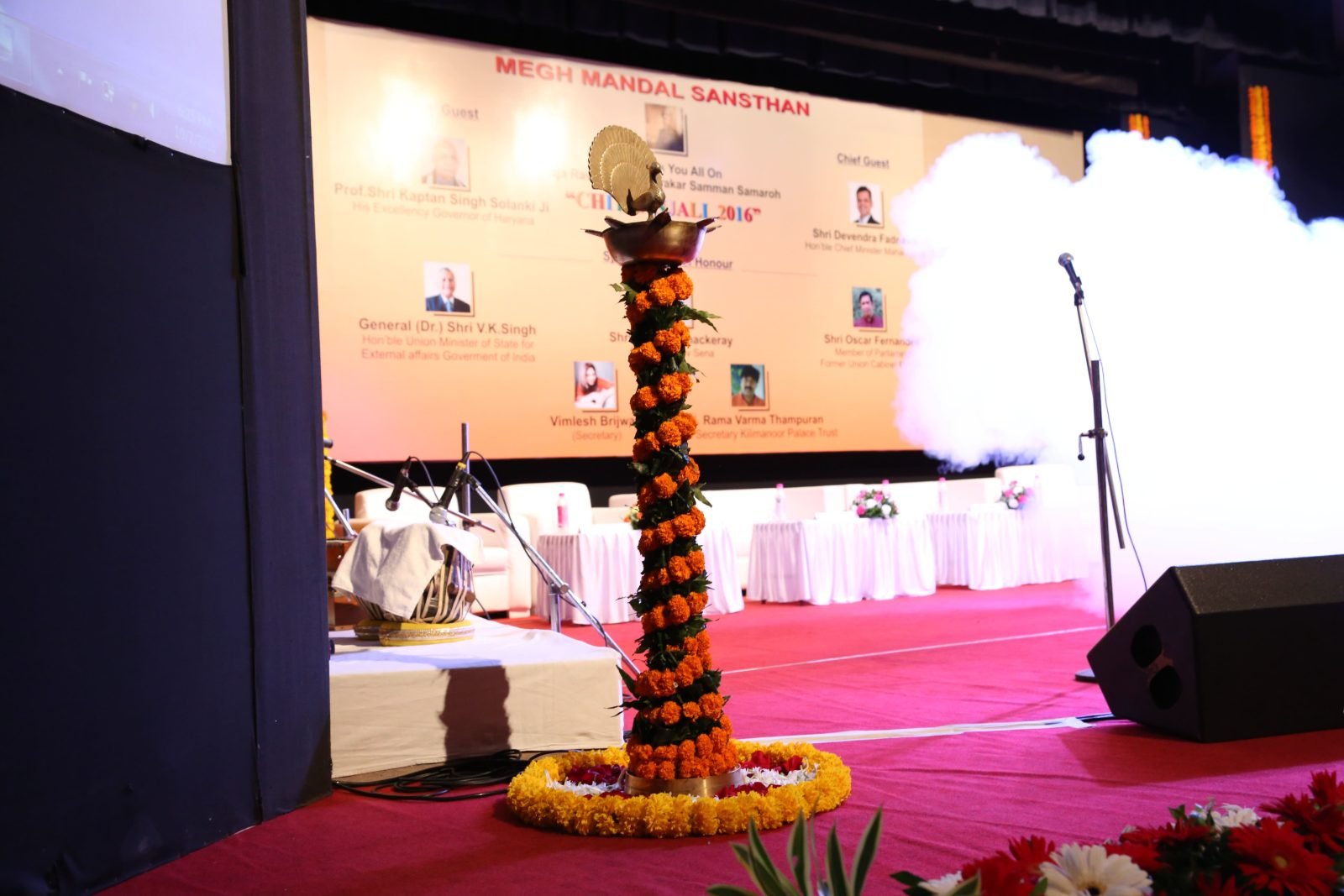An artist being honoured on stage at Chitranjali 2016