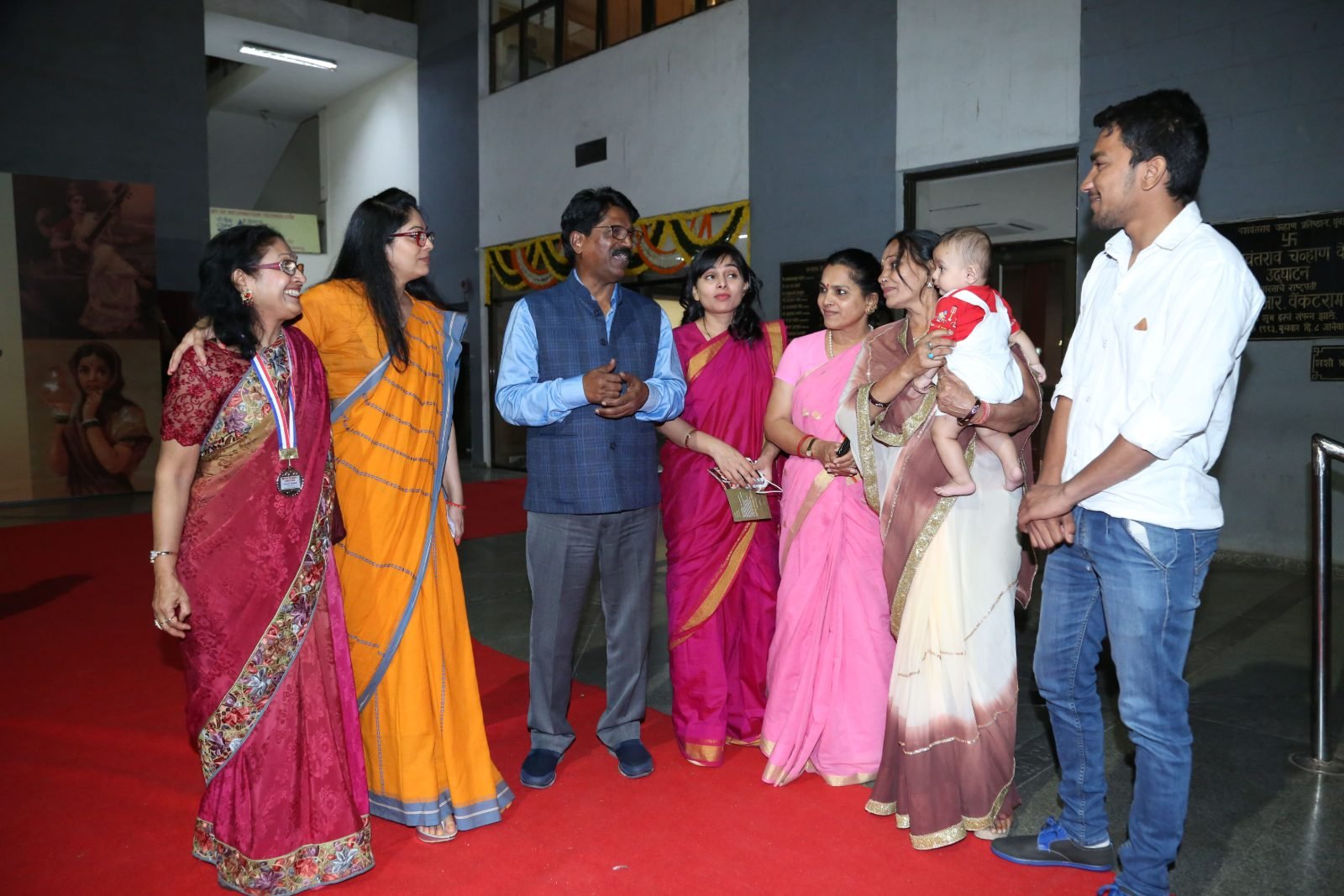 An honoured artist with her family in the foyer after the ceremony