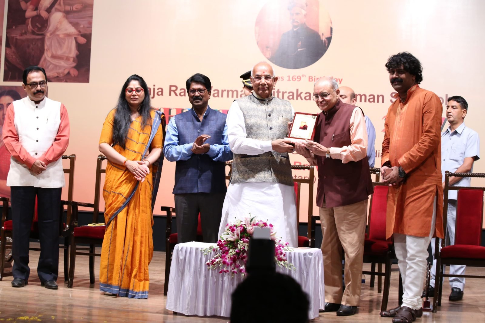 A memento being handed over on stage at Chitranjali 2017