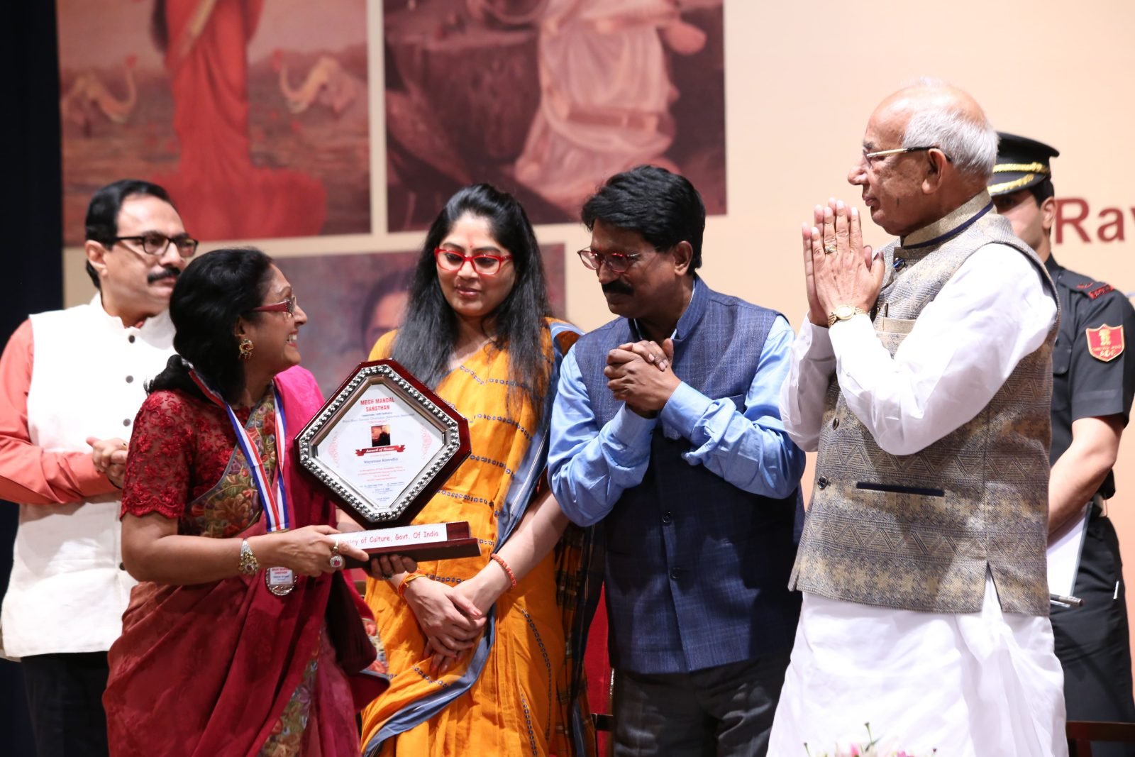 Guests of honour applauding an awardee at Chitranjali 2017
